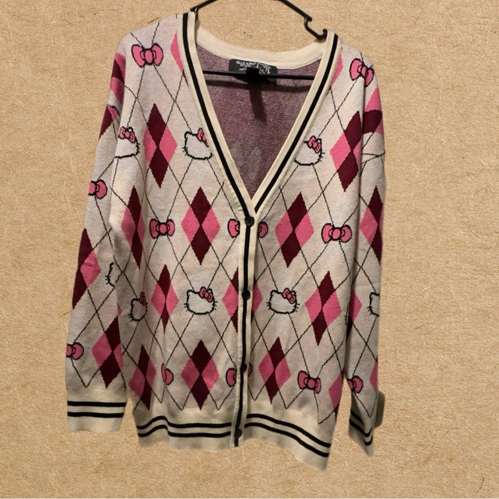 Hello Kitty & Friends Argyle Cardigan Sweater.
Sz. M Preowned in great condition